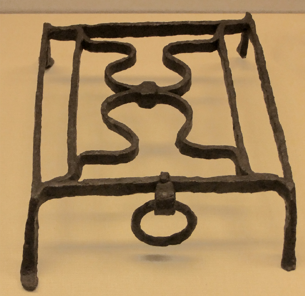 Roman grid iron for setting over fire troughs.