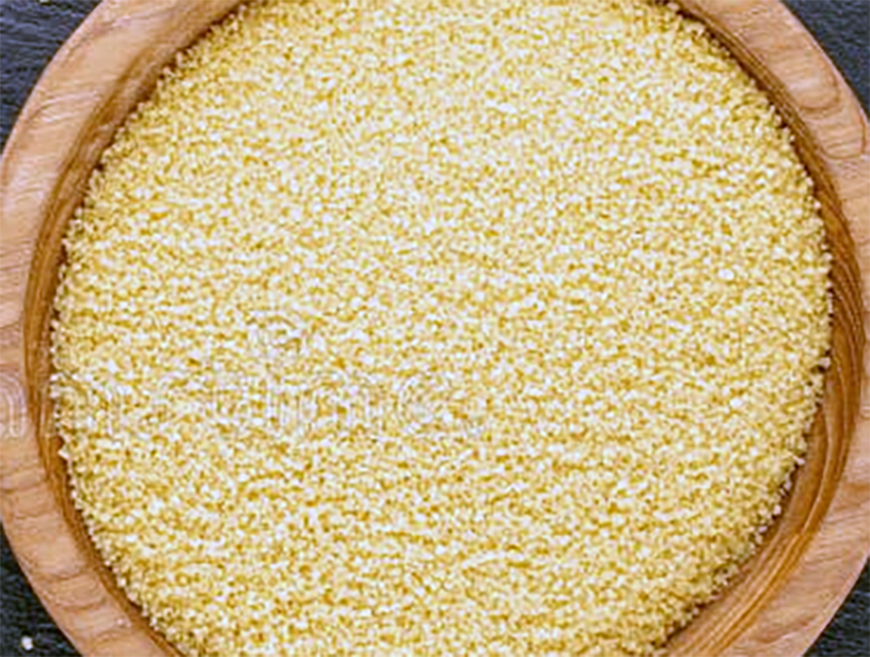 Couscous in a wooden bowl