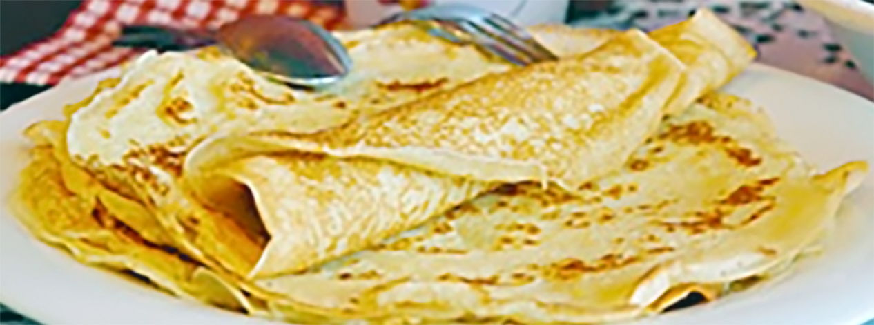Plate of thin crepe-style pancakes