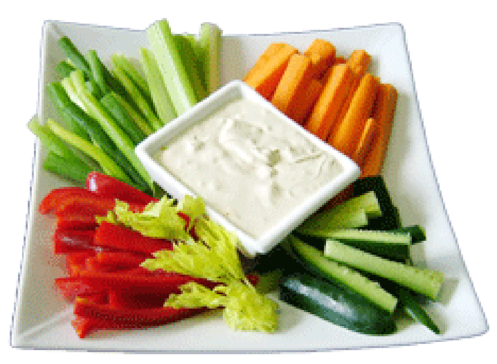 Crudites, batons of carrot, cucumber, red bell pepper and celery surrounding a white dipping sauce