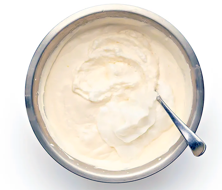 Elizabethan-style syllabub prepared in a mixing bowl