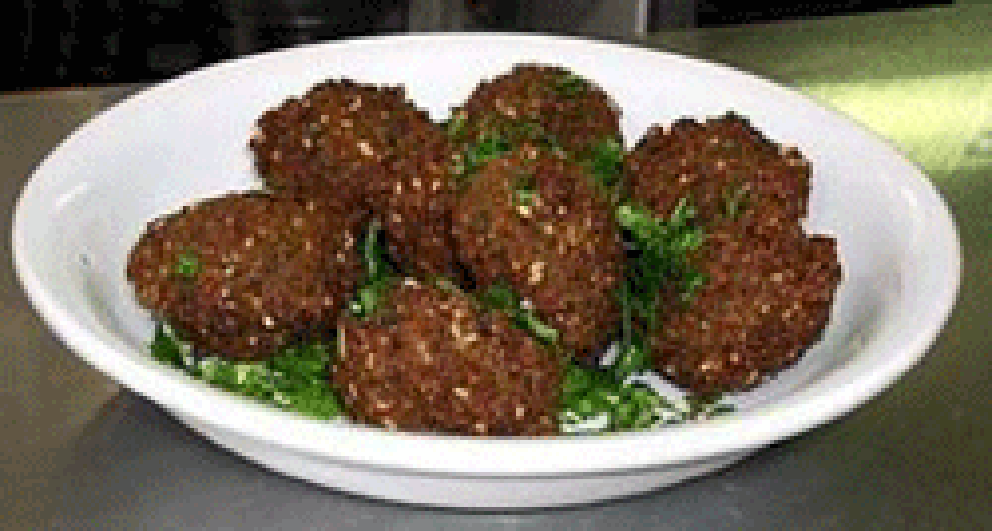 Falafel balls, arranged in a serving bowl