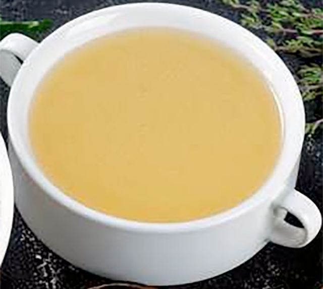 Fresh fish fumet in a bowl