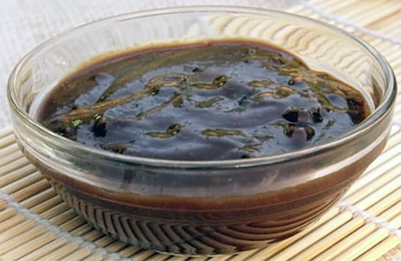 Hoisin sauce presented in a white bowl