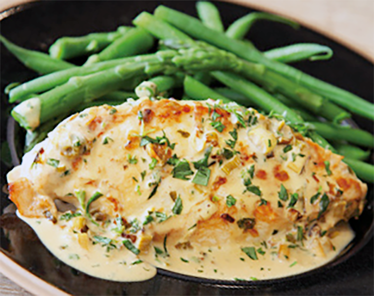 Dish of chicken with asparagus garnish