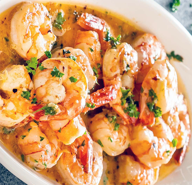 Prawns served on herb butter, a classic French entree (starter)