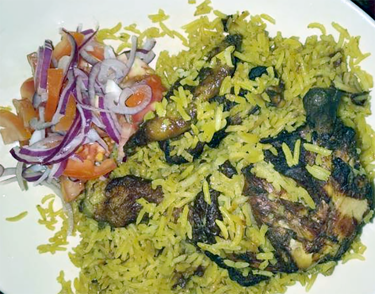 Rechauffe chicken, dish of re-heated chicken, rice and spinach