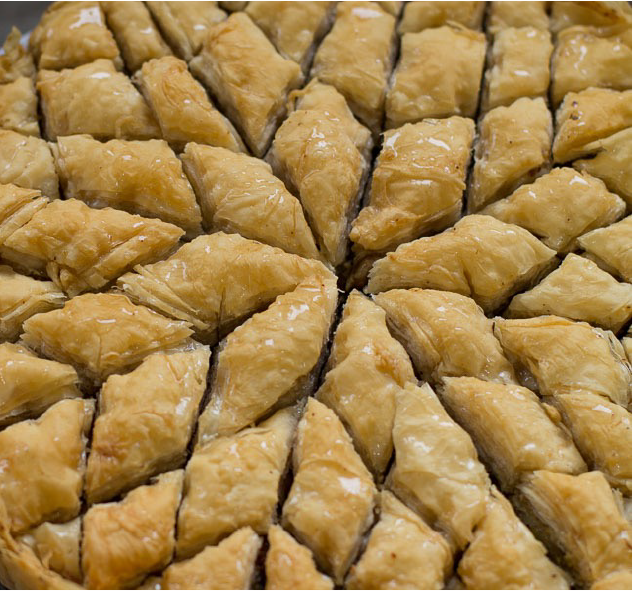 Iranian baklava flavoured with advieh cut into a flower-shaped pattern