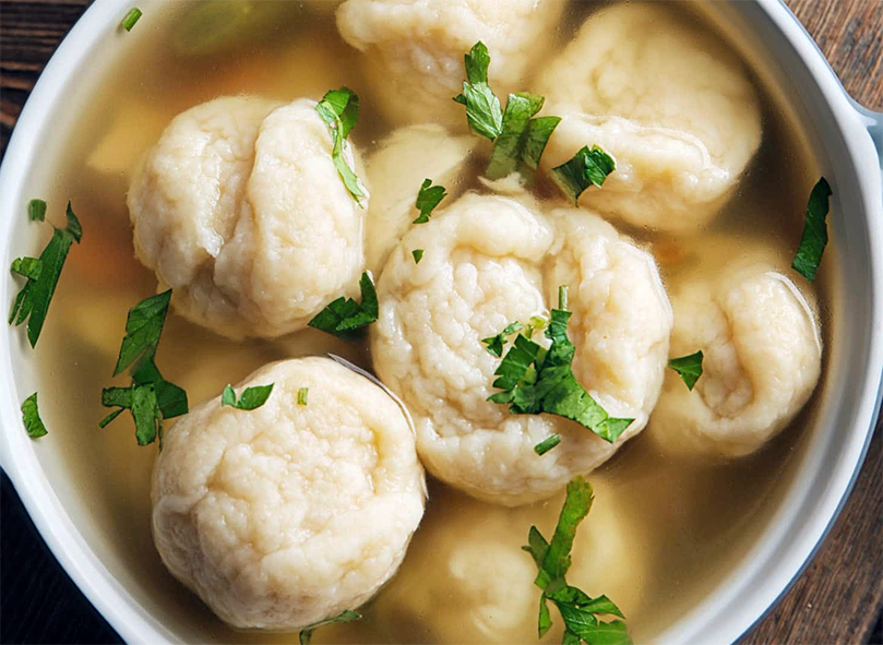 American-style dumplings simmering in stock