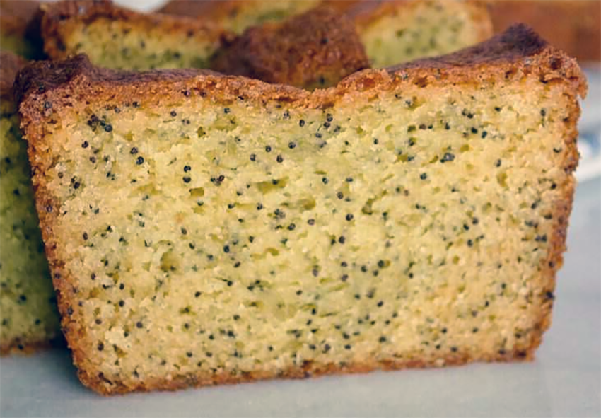 slice of poppyseed loaf standing on a white counter top