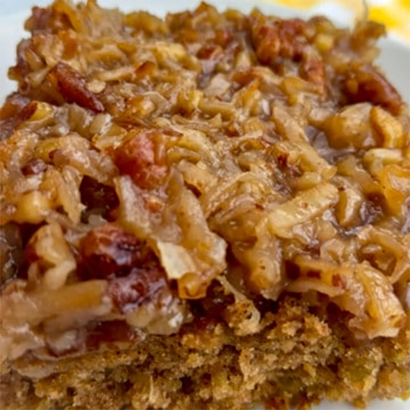 slice of Amished rolled oats and pecan cake with coconut syrup topping