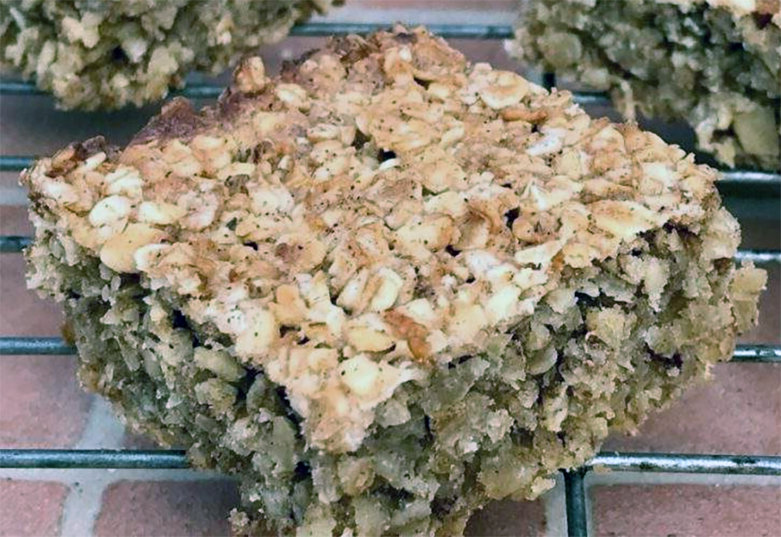 square of apple and pear flapjack on a wire rack