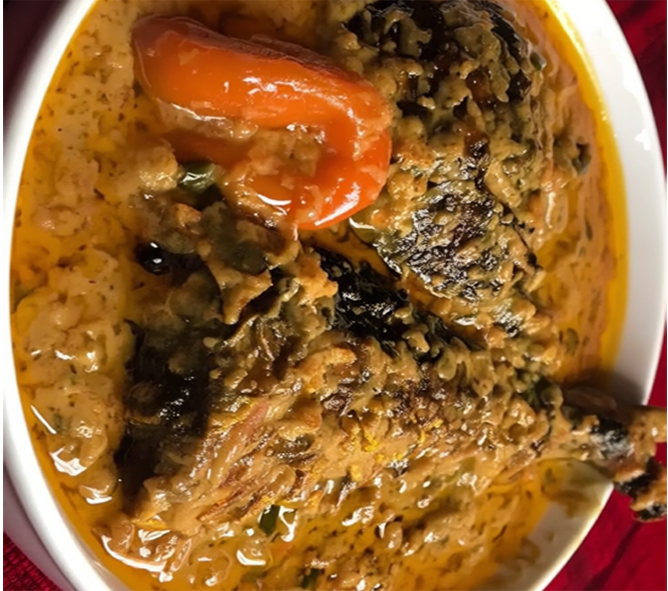 dried fish in a peanut soup base served with a whole hot chilli
