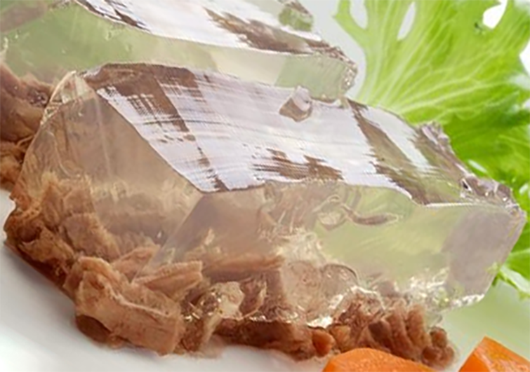 clear aspic jelly on a bed of meat
