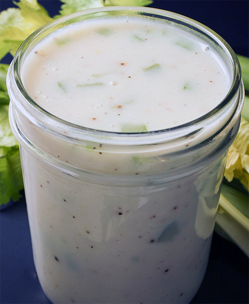 creamy celery sauce in a glass jar