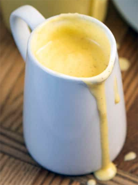 pouring custard sauce in a jug