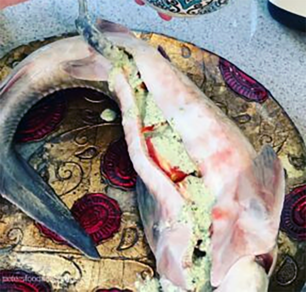 roast stuffed sturgeon on a plate