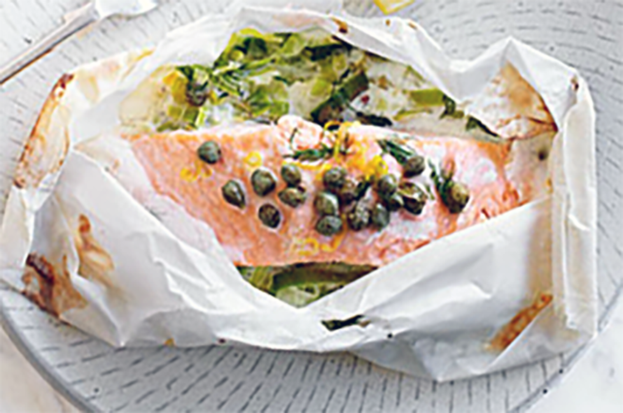 salmon in a paper parcel with caper sauce