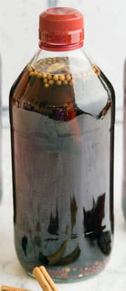 home-made brined and spiced pickling malt vinegar in a bottle