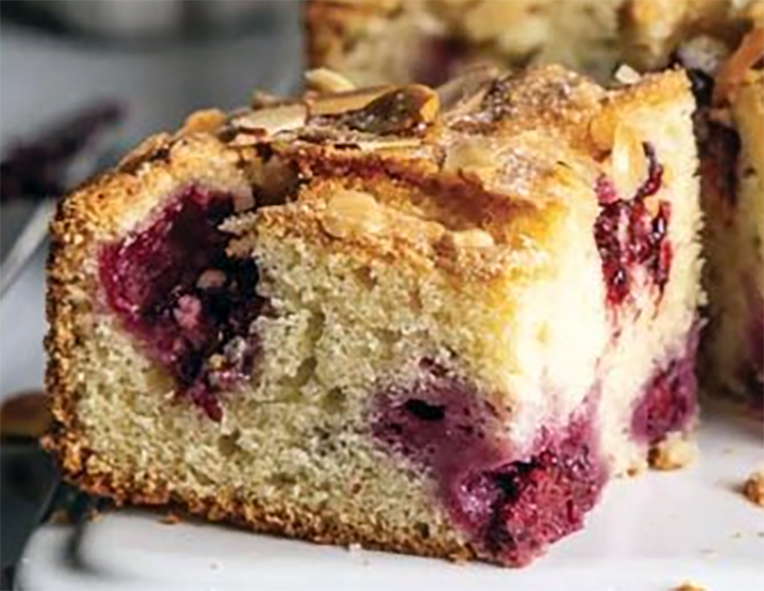 square of blackberry and almond snacking cake on a work top