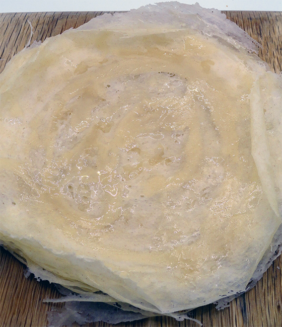 mound of fried Dayouls pastry sheets on a chopping board