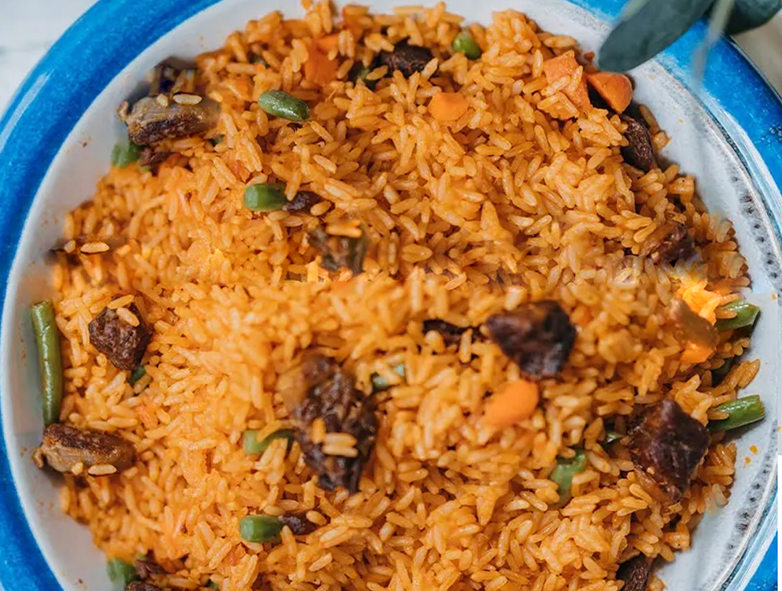 Cameroonian jellof rice arranged on a plate