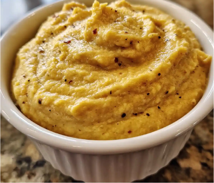 pease pudding of green split peas and carlin peas mounded in a white ramekin