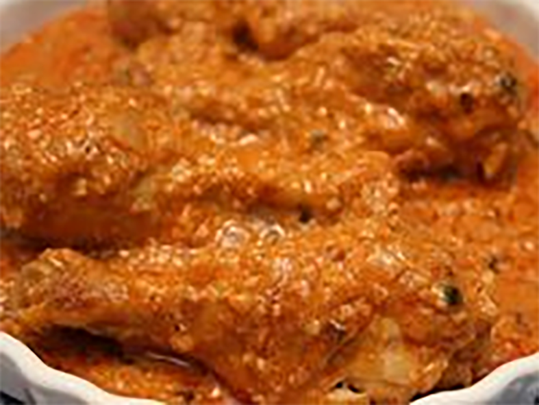 smoked chicken pieces in peanut sauce