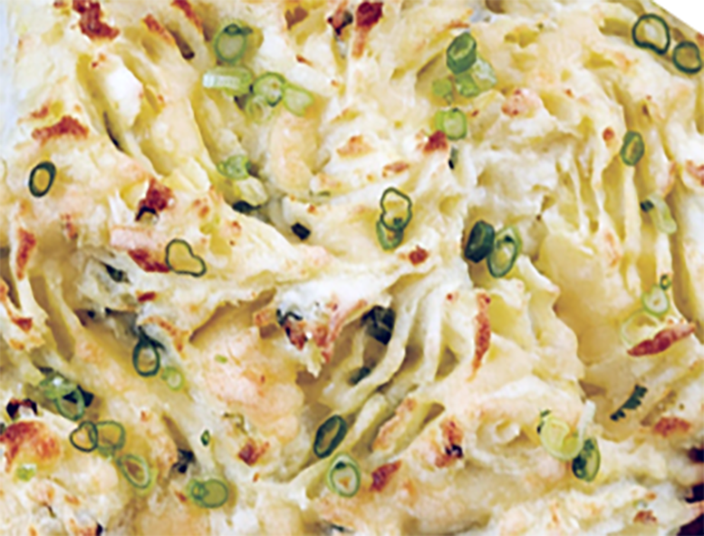 cheesy potato champ with common mallow cheese served in a baking dish