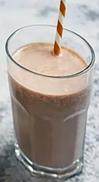chocolate, date and cashew nut smoothie in a glass