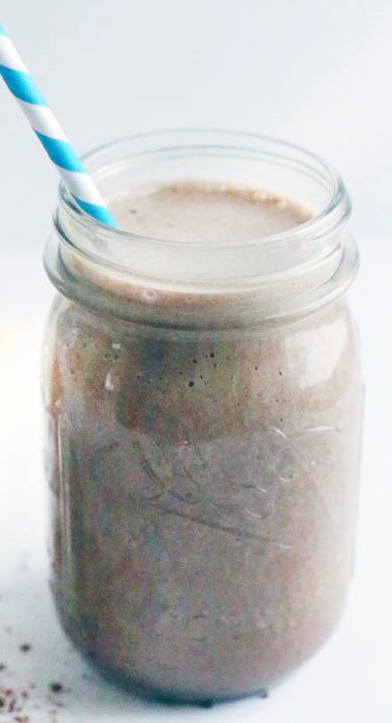 Chocolate Peanut Butter Banana Smoothie in a jar with a straw