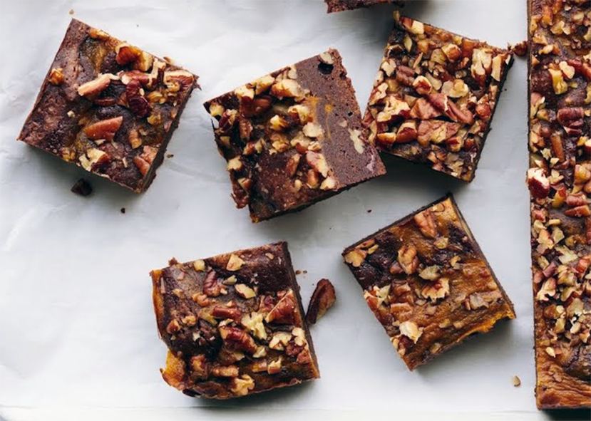 squares of chocolate, pumpkin and pecan brownies on a marble slab