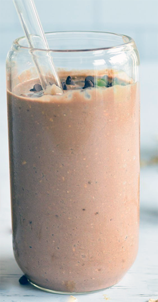 chocolate soy milk smoothie in a tall glass