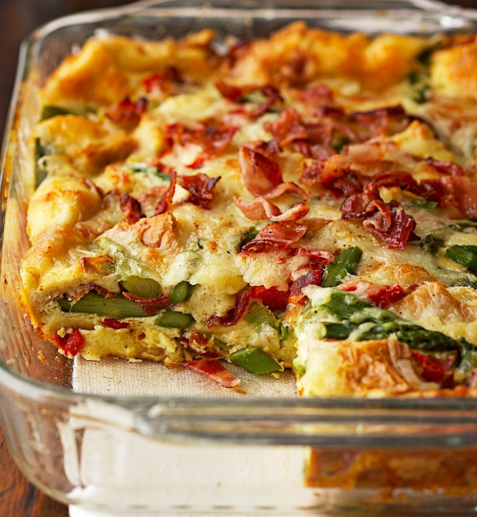 strata of chorizo and common mallow shoots in a glass baking dish