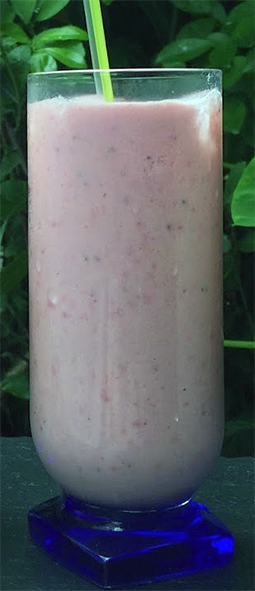 condensed milk, banana and strawberry smoothie in a glass