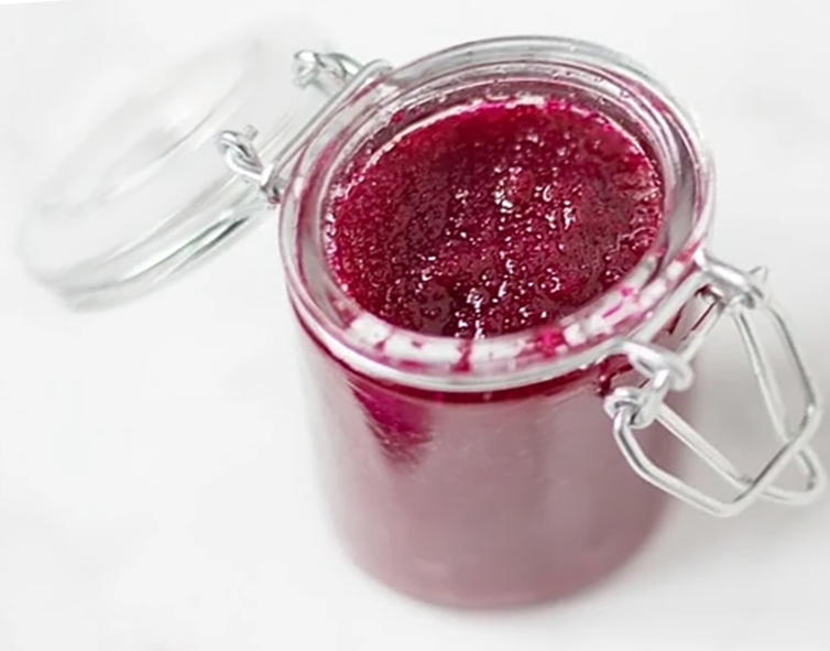 chopped rose petal and sugar conserve in a glass jar