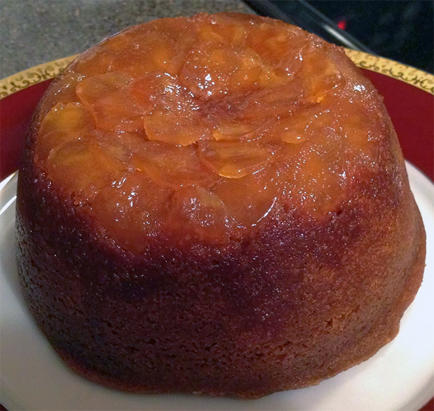 Steamed cornmeal gingerbread pudding on a plate