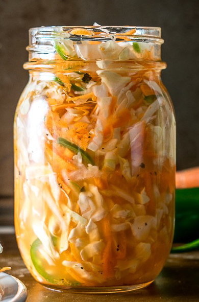 curtido picante, spicy pickled slaw in a glass jar