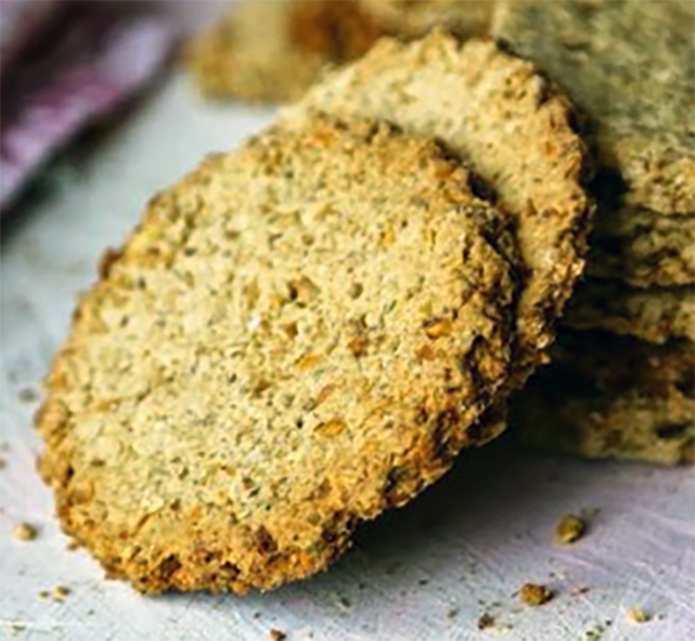 two dulse oatcakes propped against a pile of oatcakes