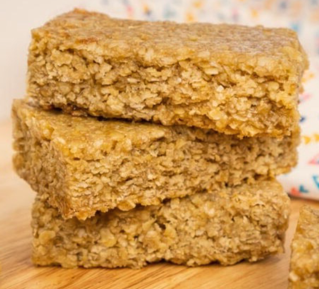 three basic butter and sugar flapjacks stacked on a wooden table