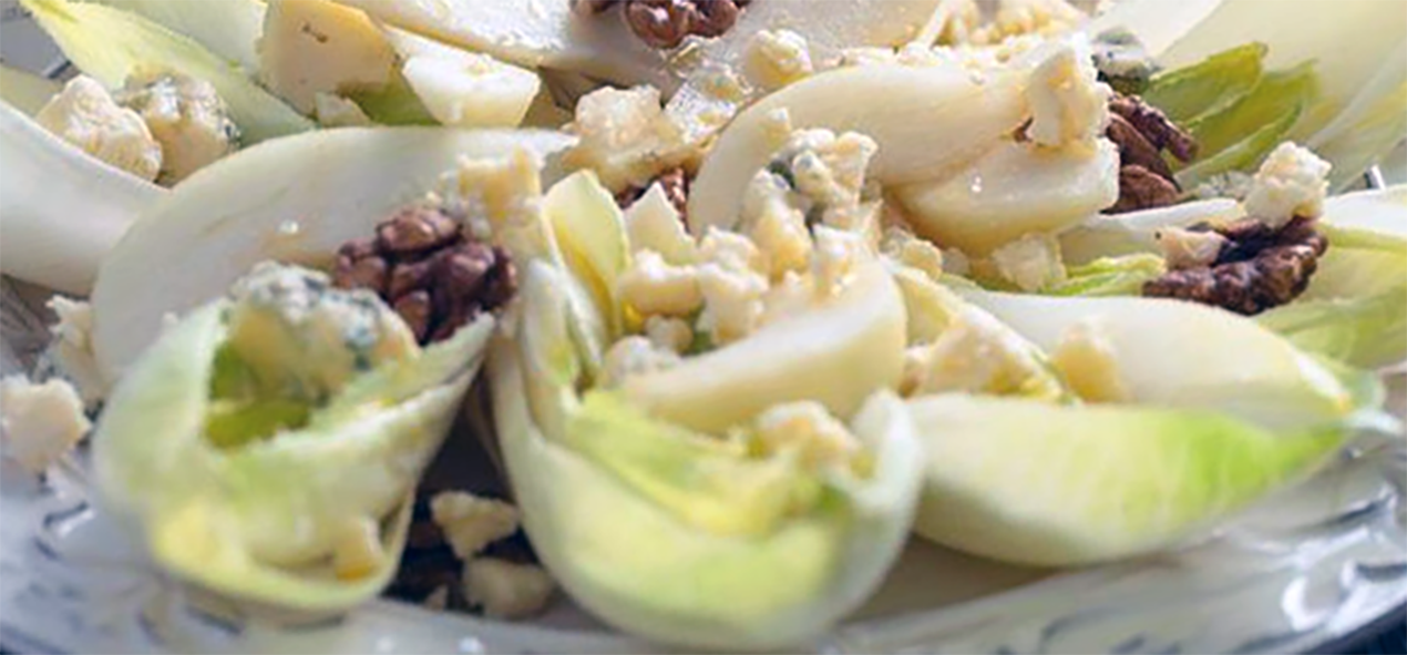 chicory leaves served in a cream, walnut, paprika and blue cheese dressing with pear slices