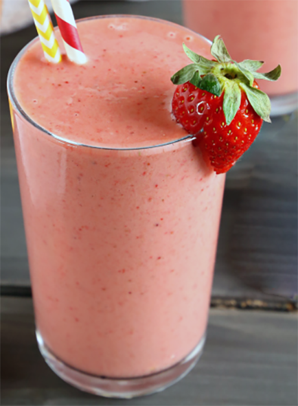 fresh fruit smoothie in a glass garnished with a strawberry
