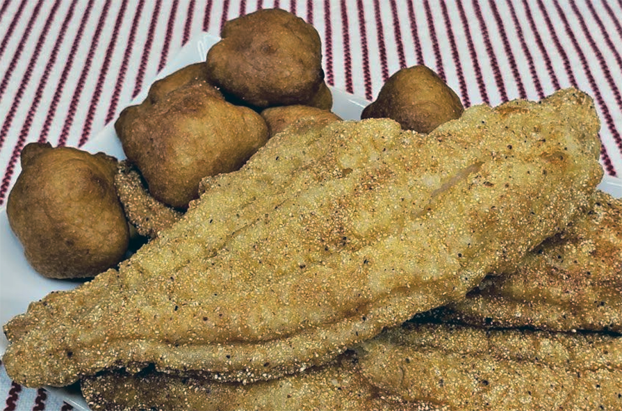 deep-fried cornmeal coated catfish served with hush puppies