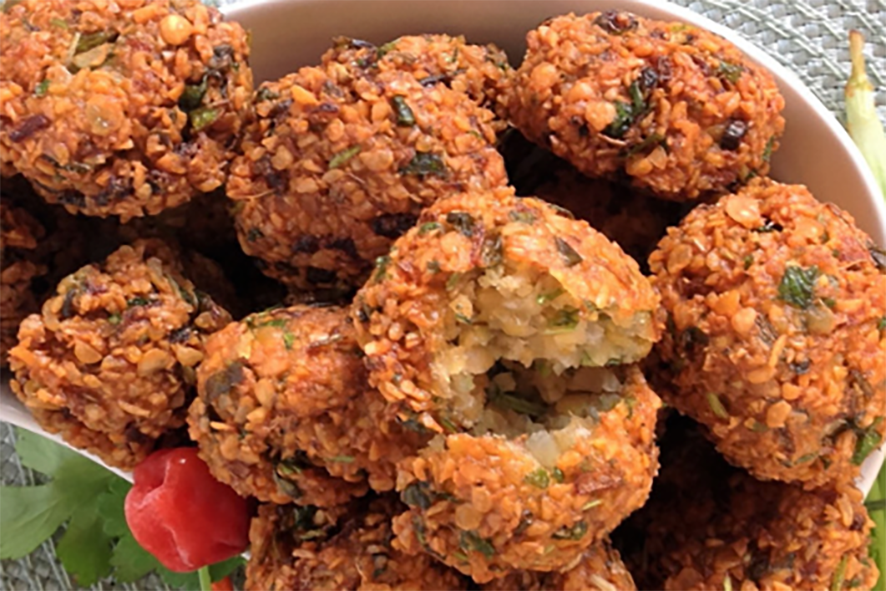 deep fried chilli and lentil fritters piled in a bowl