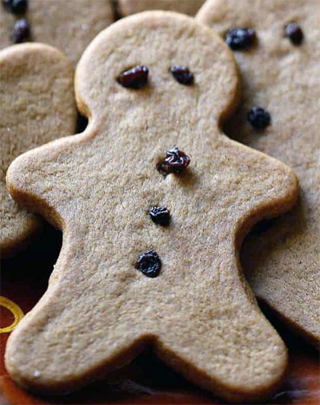 gingerbread man with currant decorations