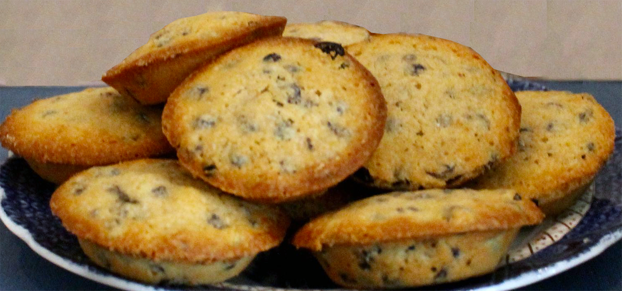 little portugal cakes piled on a plate