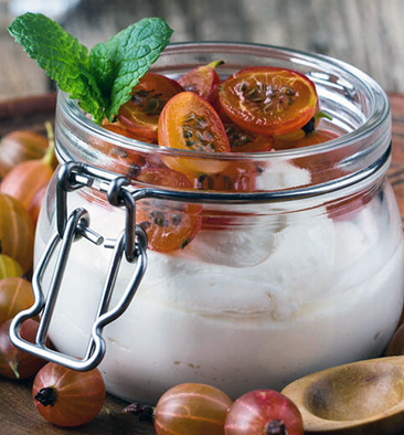 gooseberry and elderflower parfait made with red gooseberries in a glass jar