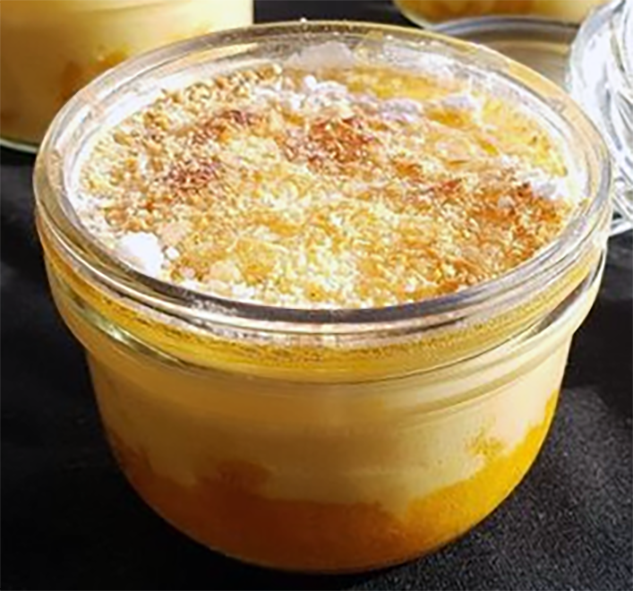 gratin of mango topped with toasted coconut served in an individual glass pot
