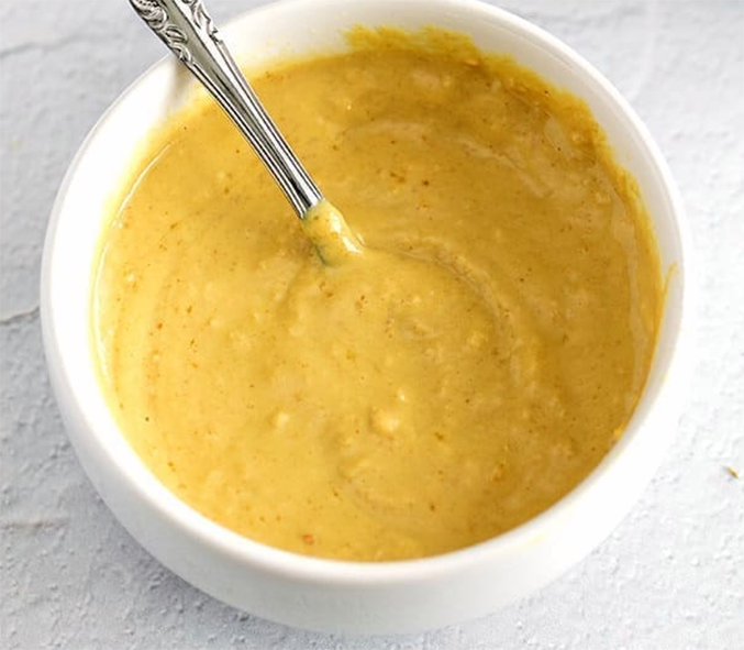 horseradish and elcampane mustard in a small bowl with a spoon