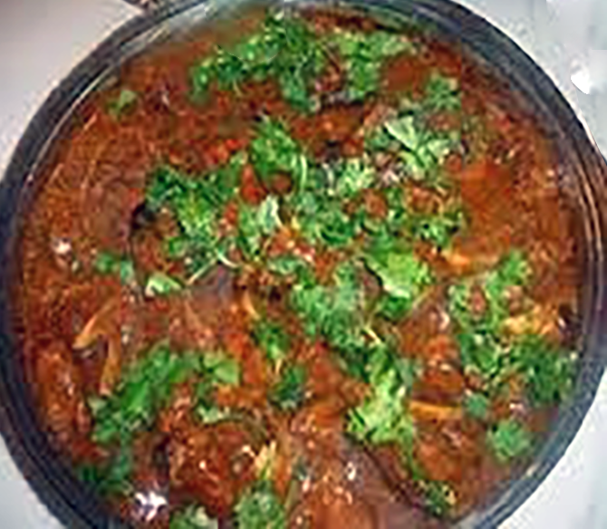 Hyderbad style dopyaza curry with coriander leaves in a bowl